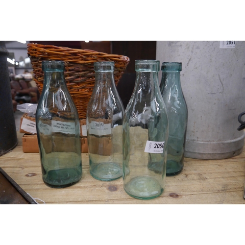 2050 - Two pairs of vintage milk bottles