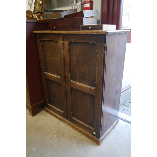 2103 - An early 20th Century Gothic style cupboard, shelved interior