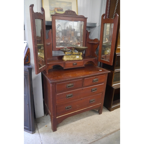 2107 - A mahogany dressing chest with two over two drawers and triple swing mirror