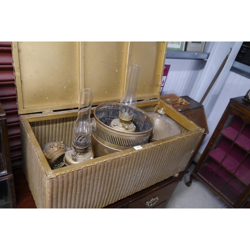 2115 - A Lloyd Loom ottoman filled with mixed brass wares