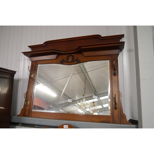 2126 - An Edwardian walnut hall mirror with brass hooks