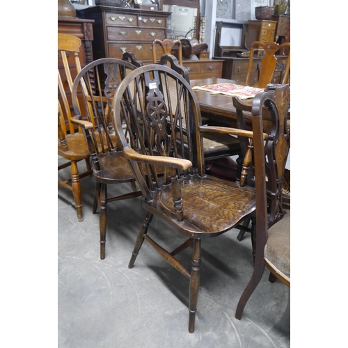 2194 - A pair of oak wheelback Windsor chairs