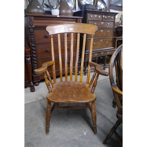 2195 - A Victorian elm seated grandfather chair