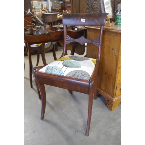 2204 - Two Regency mahogany sabre leg side chairs with allium upholstery