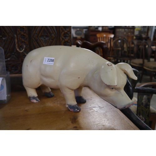 2208 - A wooden pig figure