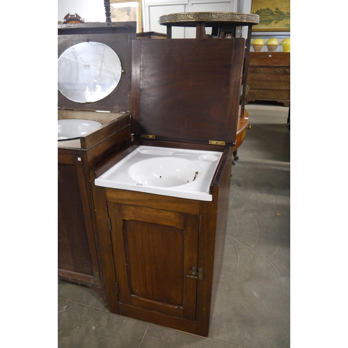 2213 - A late Victorian mahogany campaign wash cupboard with ceramic basin and brass waste