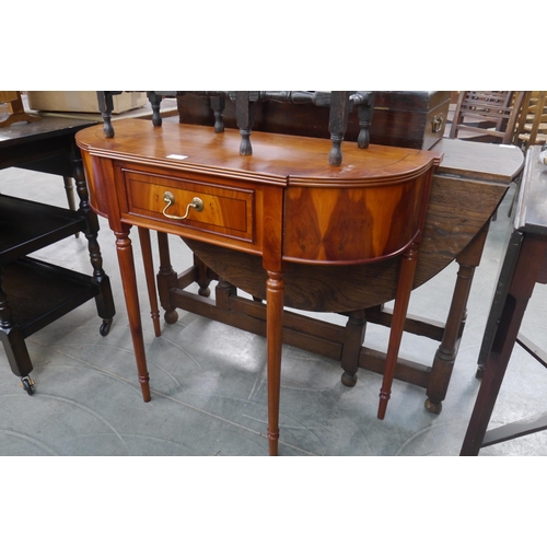 2218 - A 1980's walnut veneer demi-lune table