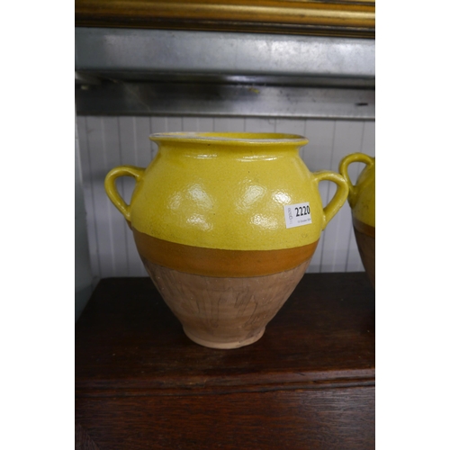 2220 - A yellow glazed twin handled pot