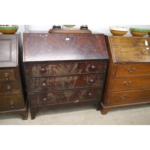 2234 - A Victorian flame mahogany three drawer bureau