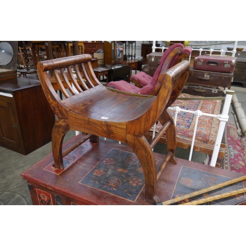 2244 - An oriental hardwood X-framed seat