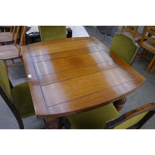 2248 - A 1940's oak dining table and four chairs