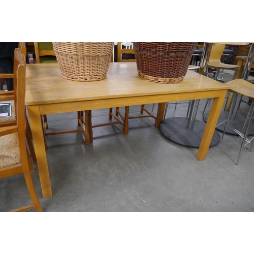 2271 - A light oak dining table