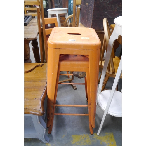 2286 - Two conjoined orange metal stools