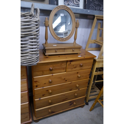 2315 - A modern pine chest of two short over four long drawers with associated dressing table mirror, toget... 