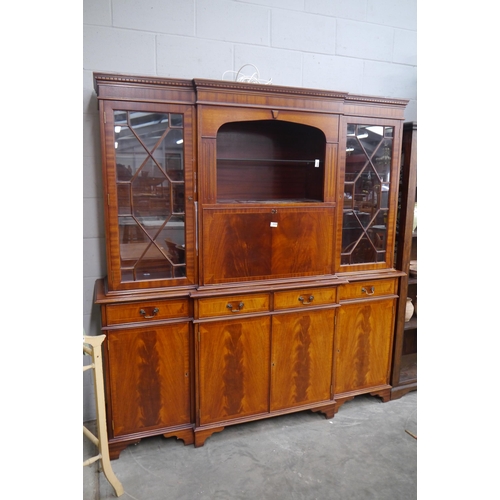 2329 - A Georgian style mahogany full height glazed dresser in two sections, four drawers over four doors