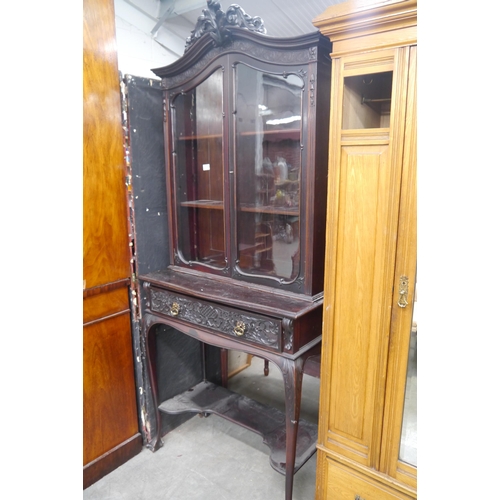 2350 - A late 19th Century carved mahogany display cabinet on stand