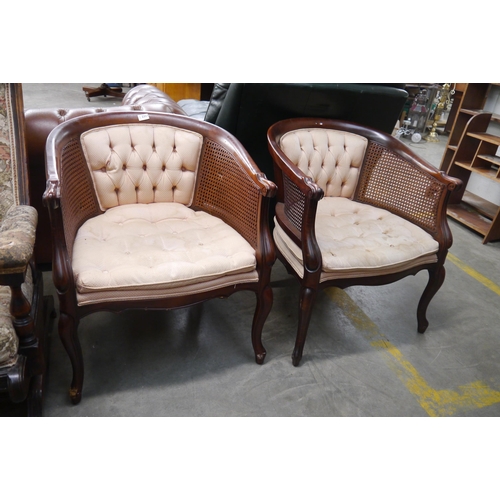 2357 - A pair of mahogany cane sided chairs for re-upholstery