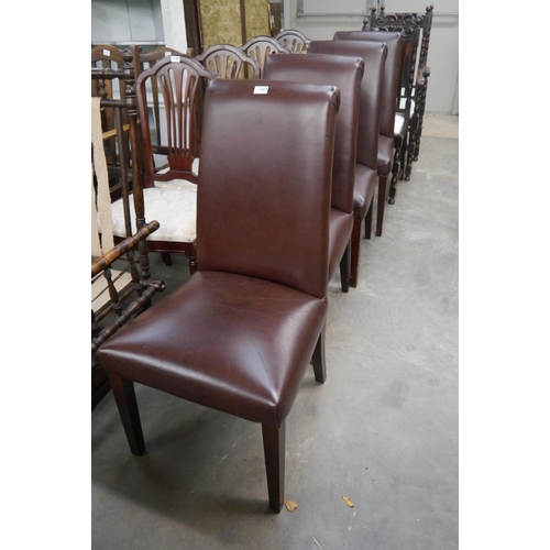 2363 - A set of four brown leather dining chairs