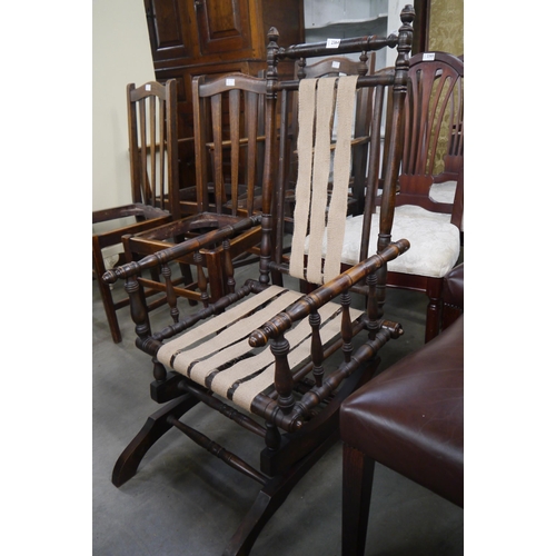 2364 - A Victorian walnut rocking chair with hessian webbing