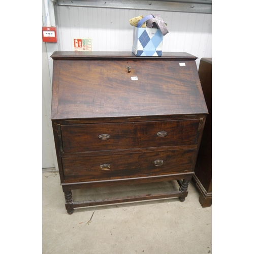 2368 - A 19th Century mahogany bureau, fall front over two long drawers, turned legs to box stretcher base