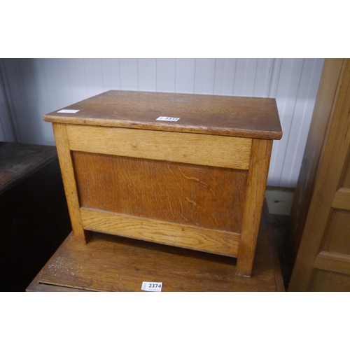 2375 - A small blond oak box stool