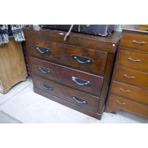 2412 - A hardwood chest of three drawers