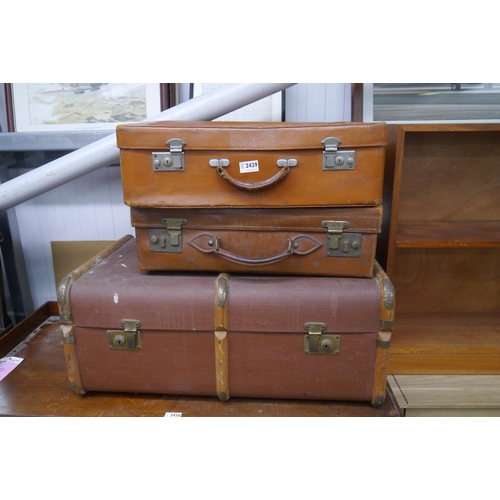 2429 - Two brown leather travel cases and a trunk