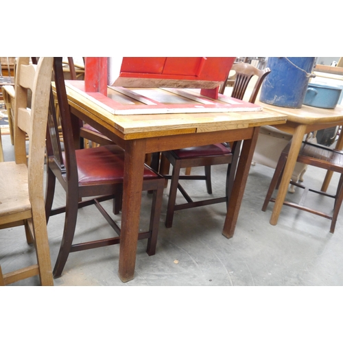 2437 - A 1940’s light oak drawer-leaf dining table