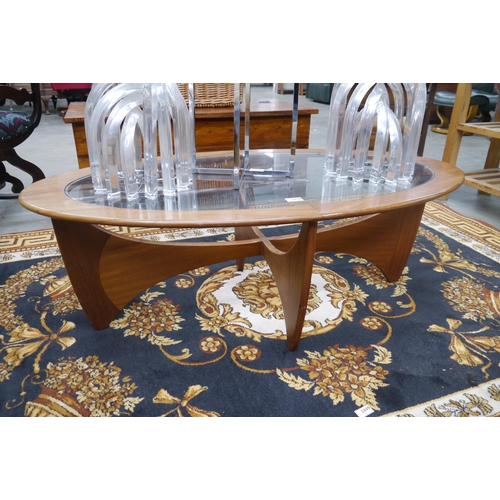 2446 - An oval glass topped teak G-Plan coffee table