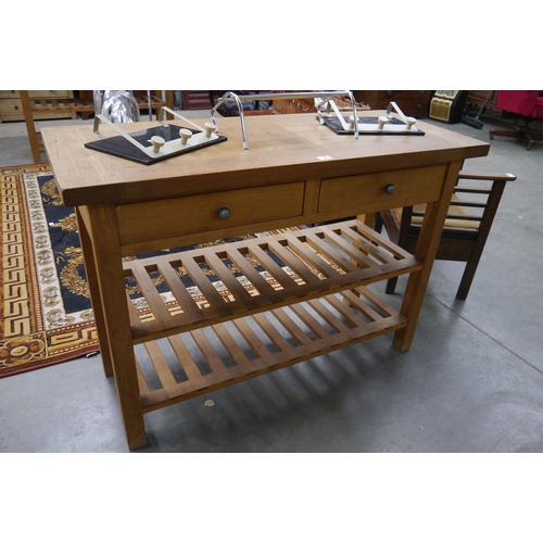 2451 - An oak drawer side table server with slatted under tier 4' wide