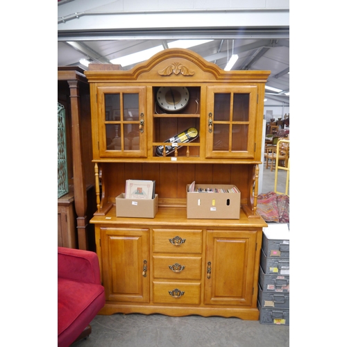 2461 - A modern hardwood full height dresser, glazed two door top with central alcove, over a three drawer ... 