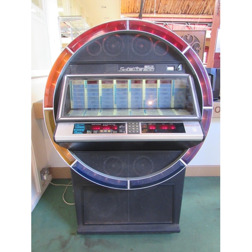 7427 - A 1980s NSM Satellite 200 vinyl jukebox, earlier model with multi-coloured ring of lights to front w... 