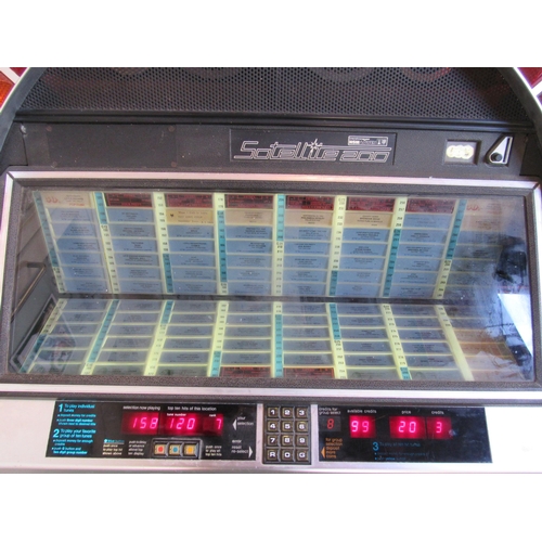 7427 - A 1980s NSM Satellite 200 vinyl jukebox, earlier model with multi-coloured ring of lights to front w... 