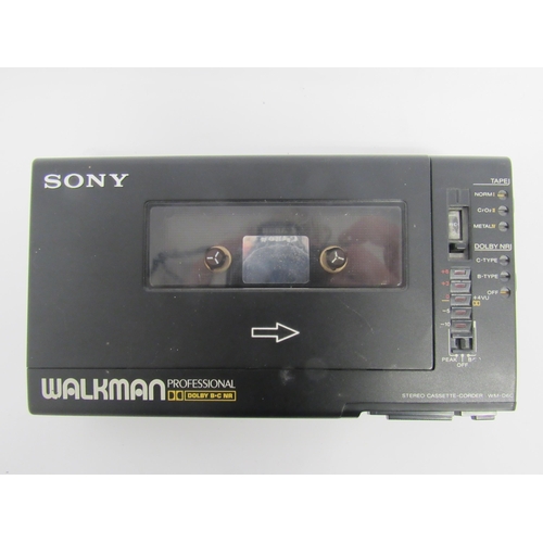 7476 - A boxed Sony WM-D64 Professional Stereo Cassette Recorder, lacking battery cover, with accompanying ... 