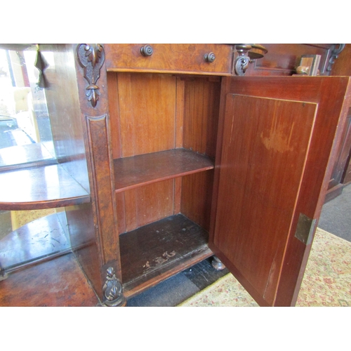 1116 - A Victorian flame walnut mirror-back credenza, twin shelved corner alcoves, loose foot, top not atta... 