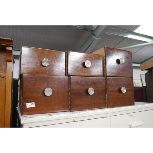 2353 - Seven mahogany drawers