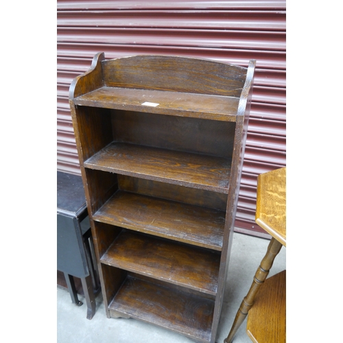 2469 - A 1930's dark oak narrow bookcase