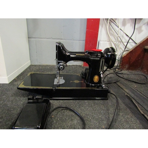 1279 - A Singer Featherweight sewing machine, cased with accessories