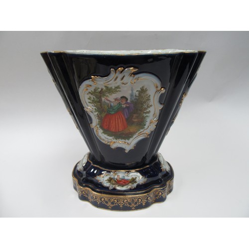 4077 - A hard paste two section jardiniere, cobalt blue ground, cartouche depicting lovers and still-life o... 