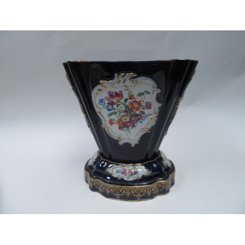 4077 - A hard paste two section jardiniere, cobalt blue ground, cartouche depicting lovers and still-life o... 