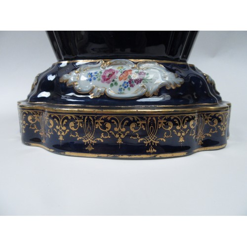 4077 - A hard paste two section jardiniere, cobalt blue ground, cartouche depicting lovers and still-life o... 