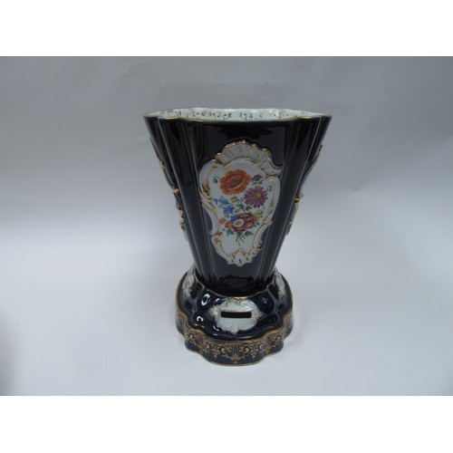 4077 - A hard paste two section jardiniere, cobalt blue ground, cartouche depicting lovers and still-life o... 