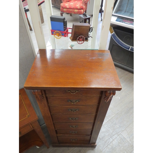 4128 - An Edwardian oak Wellington chest of seven drawers, 184cm tall x 49cm wide x 34cm deep