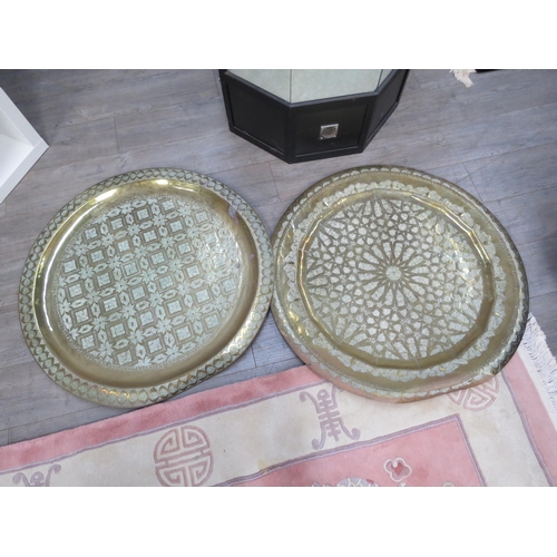 4147 - Two Iranian large brass chargers, all over etched decoration, 90cm diameter