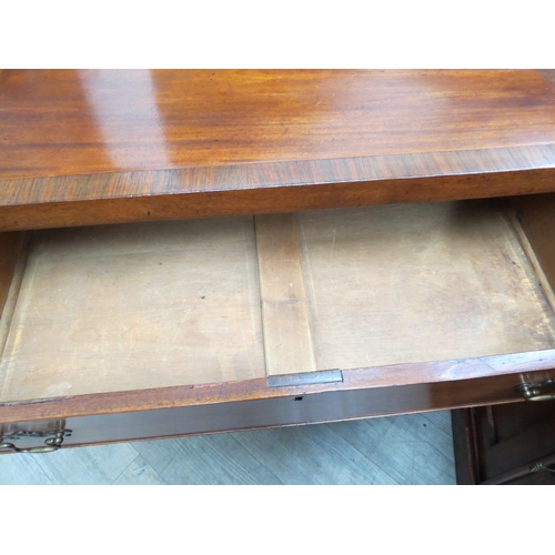 4166 - A 19th Century mahogany chest of three graduating long drawers with rosewood crossbanding over brack... 