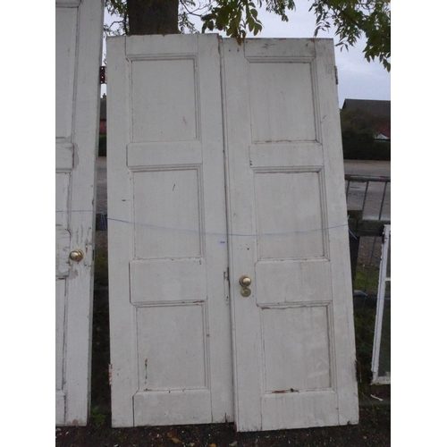 8006 - A pair of pine panelled doors, 211cm x 63cm each door