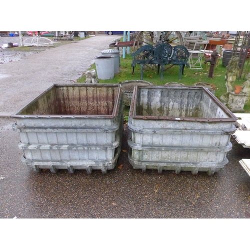 8010 - A pair of galvanised munitions factory water tanks, 37