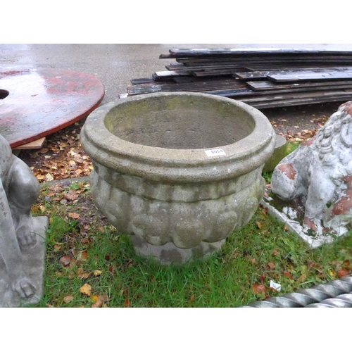 8054 - A reconstituted semi-gadrooned planter, 40cm tall, 50cm diameter