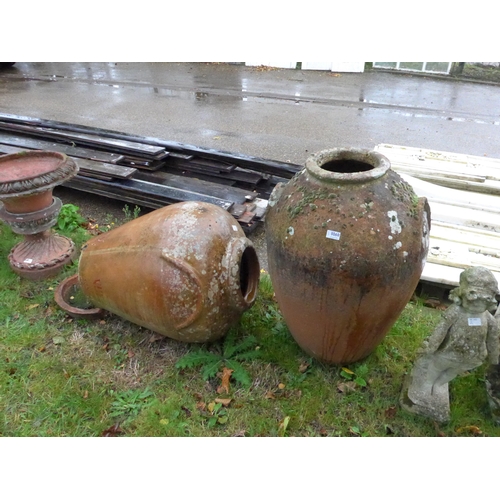 8060 - A large terracotta olive jar and another with bottom detached