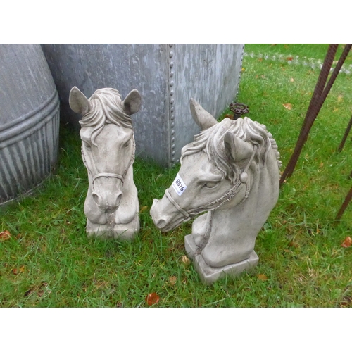 8076 - A pair of composition horse head finials, 40cm tall